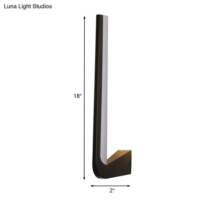 Modern black l-shaped wall sconce with brushed brass finish and integrated led light strip for direct wired electric use