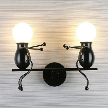 Modern black metal wall light featuring two whimsical vase-shaped figures holding spherical bulbs as man led wall light