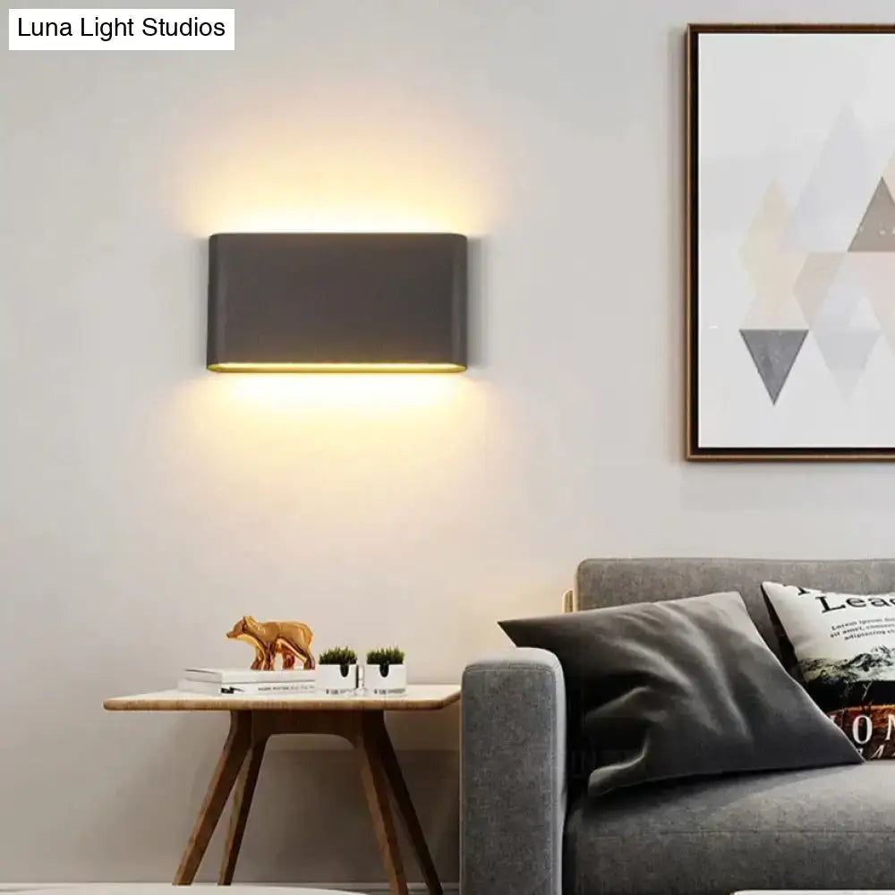Modern black luna outdoor wall light with sleek dark gray finish and warm led ambient lighting for patio use