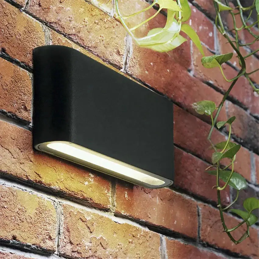 Modern black luna outdoor wall light with sleek rectangular design and warm white led illumination for patios
