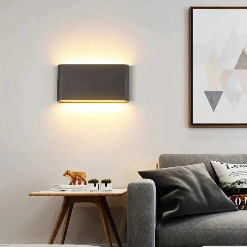 Modern black luna outdoor wall light with a sleek matte gray finish and warm ambient led lighting for patios