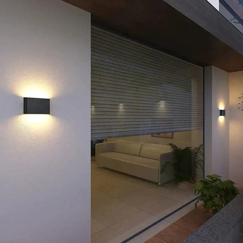 Modern black luna outdoor wall light with warm led illumination for patio and outdoor wall use