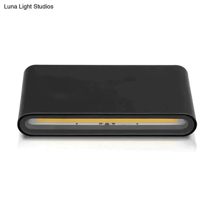 Modern black luna outdoor wall light featuring a sleek rectangular led wall sconce with integrated warm yellow light strip