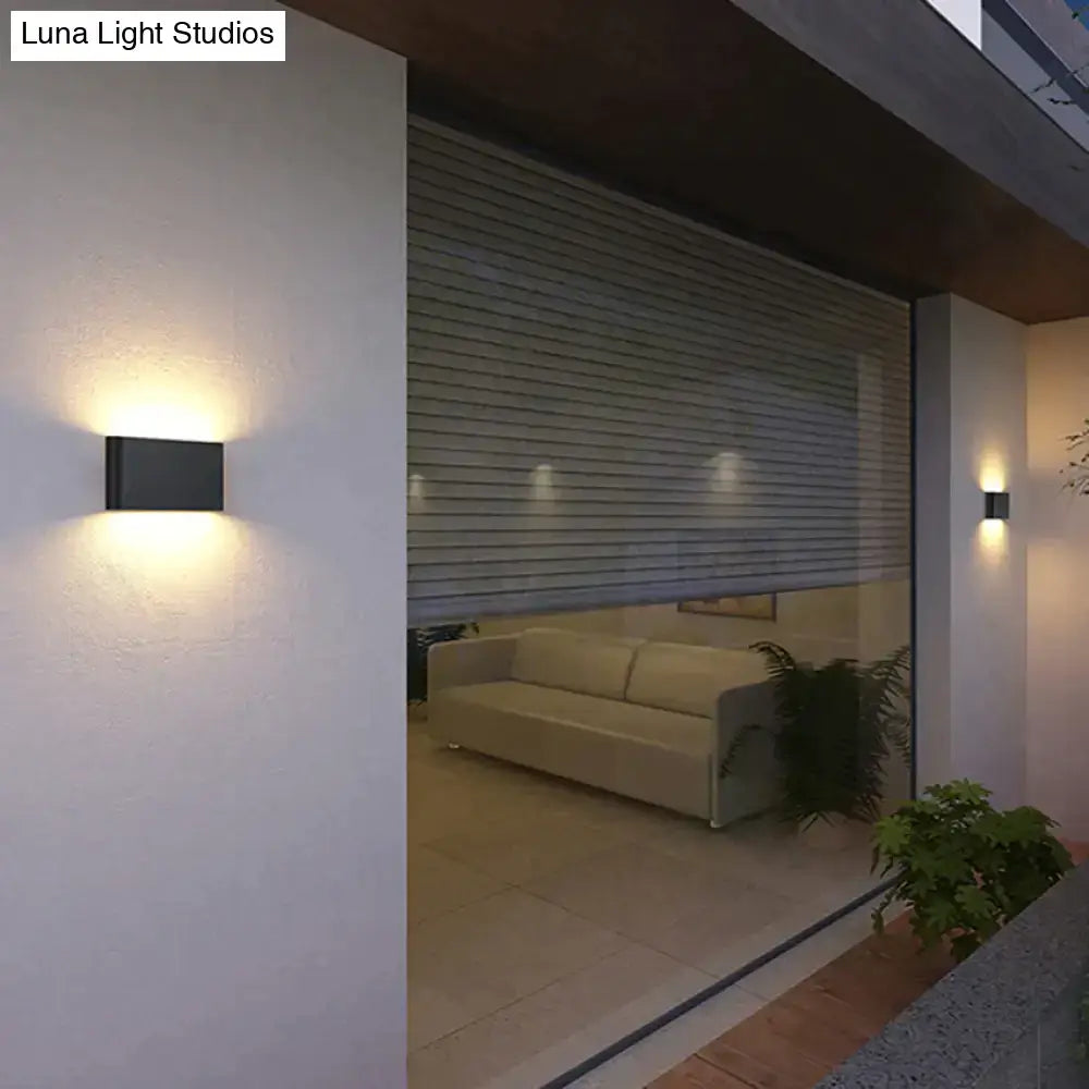 Modern black luna outdoor wall light with warm LED glow for ambient patio lighting and outdoor wall use