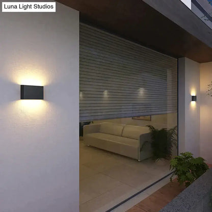 Modern black luna outdoor wall light with warm LED glow for ambient patio lighting and outdoor wall use