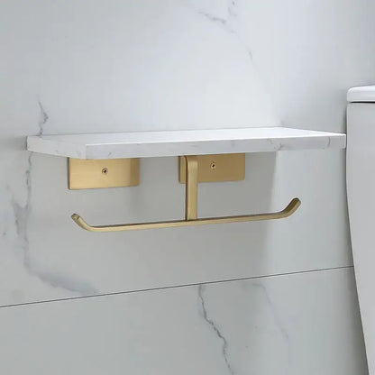 Modern black marble and gold toilet paper holder with a white marble shelf for bathroom storage and organization