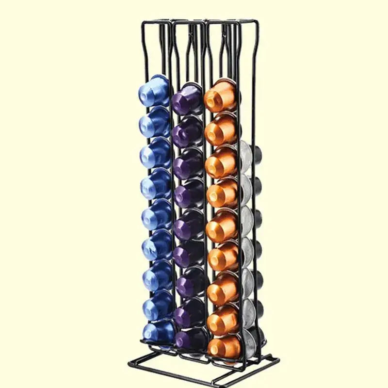 Modern black metal capsule holder stand with vertical slots holding colorful blue purple gold and silver coffee pods