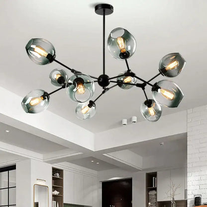 Modern black metal decorbites glass chandelier with frosted globe shades and exposed filament bulbs for dining room