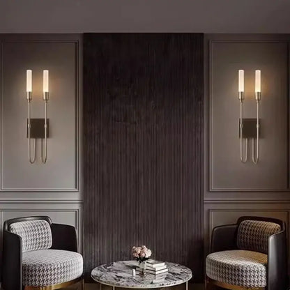 Modern black metal double headed led wall lamp with slender arms and warm glowing bulbs for bedroom decorbites double headed design