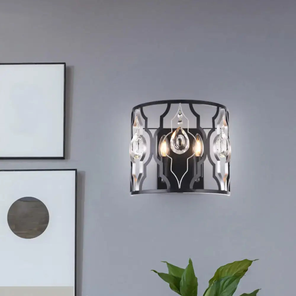 Modern black metal frame wall sconce with crystal droplets and two illuminated bulbs for bedroom lighting