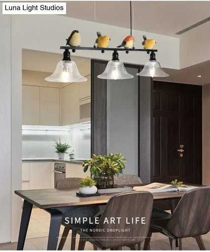 Modern black metal island pendant with birds featuring four frosted glass shades suitable for 110v-120v and 220v-240v use