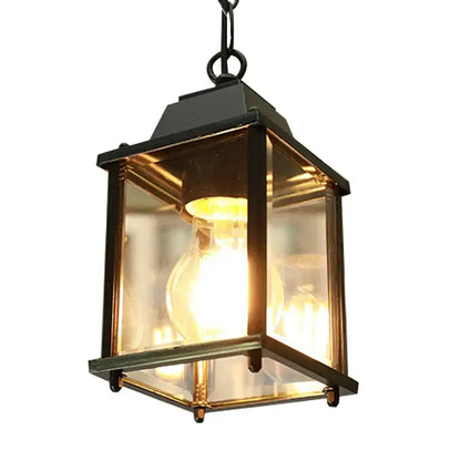 Modern black metal pendant lamp with clear glass panels and warm glowing bulb for decorbites garden pendant light
