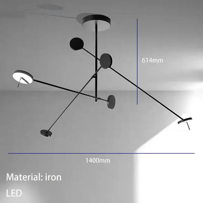 Modern black metal led chandelier with five circular led light fixtures in an asymmetrical living room design by decorbites black metal