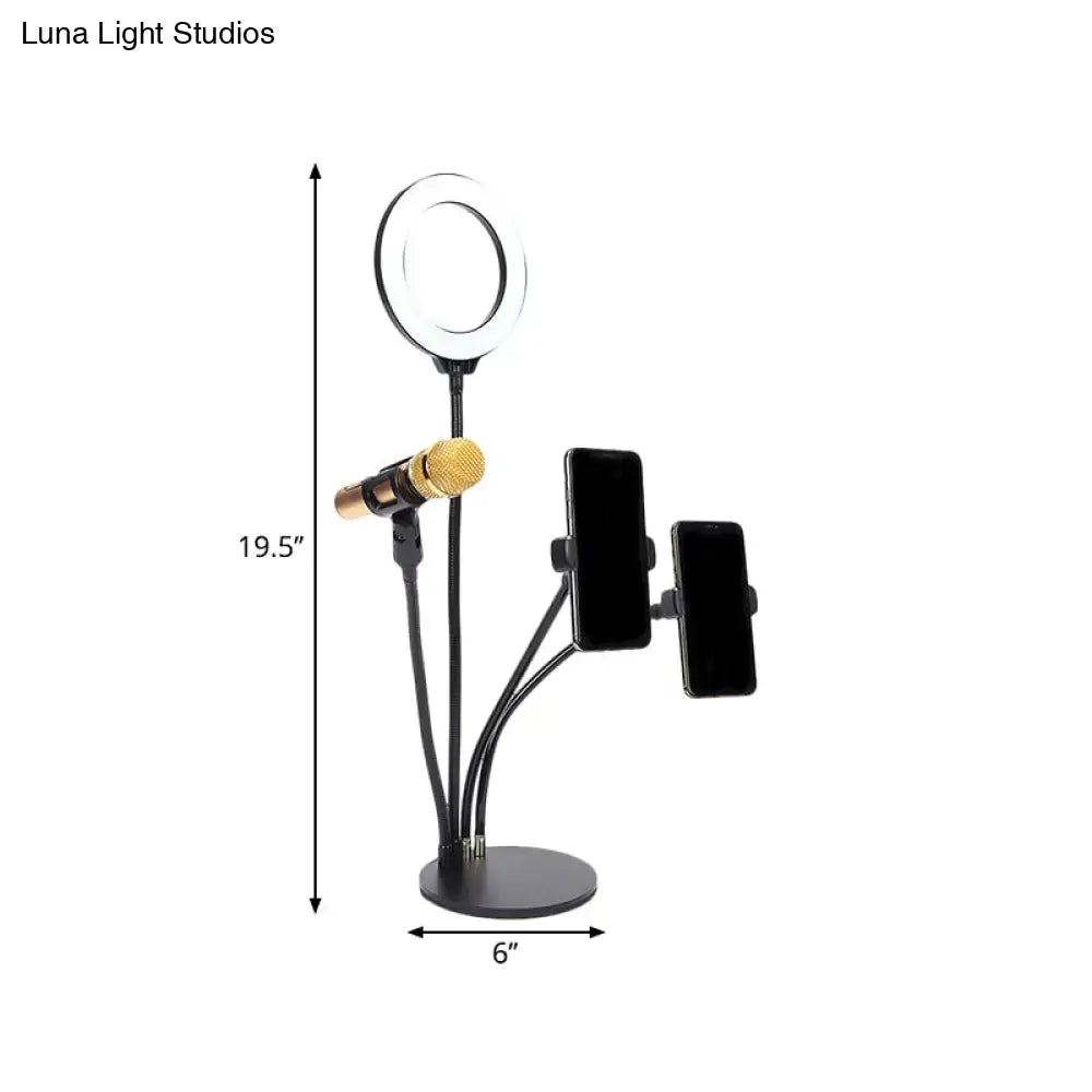 Modern black metal led circle mirror with flash lighting bedroom stand featuring adjustable arms holding ring light mic and phones