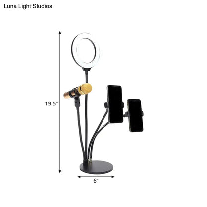 Modern black metal led circle mirror with flash lighting bedroom stand featuring adjustable arms holding ring light mic and phones