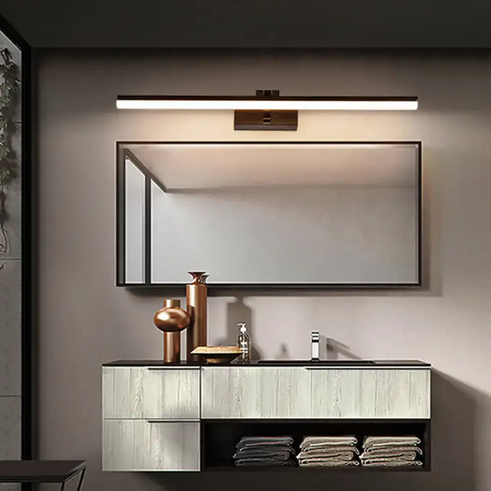 Modern black metal led light fixture with warm white light and sleek rectangular bathroom mirror with black frame