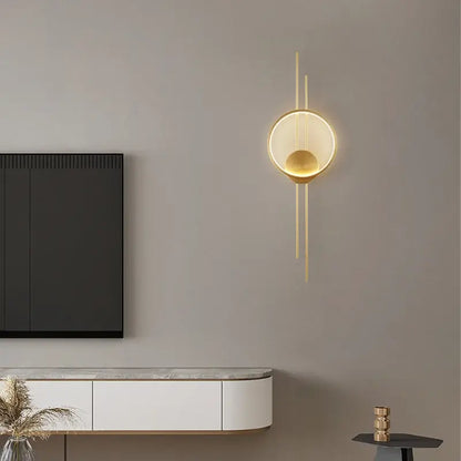 Modern gold-toned wall lights led wall lights with circular illuminated design and slender vertical accents for bedroom decorbites