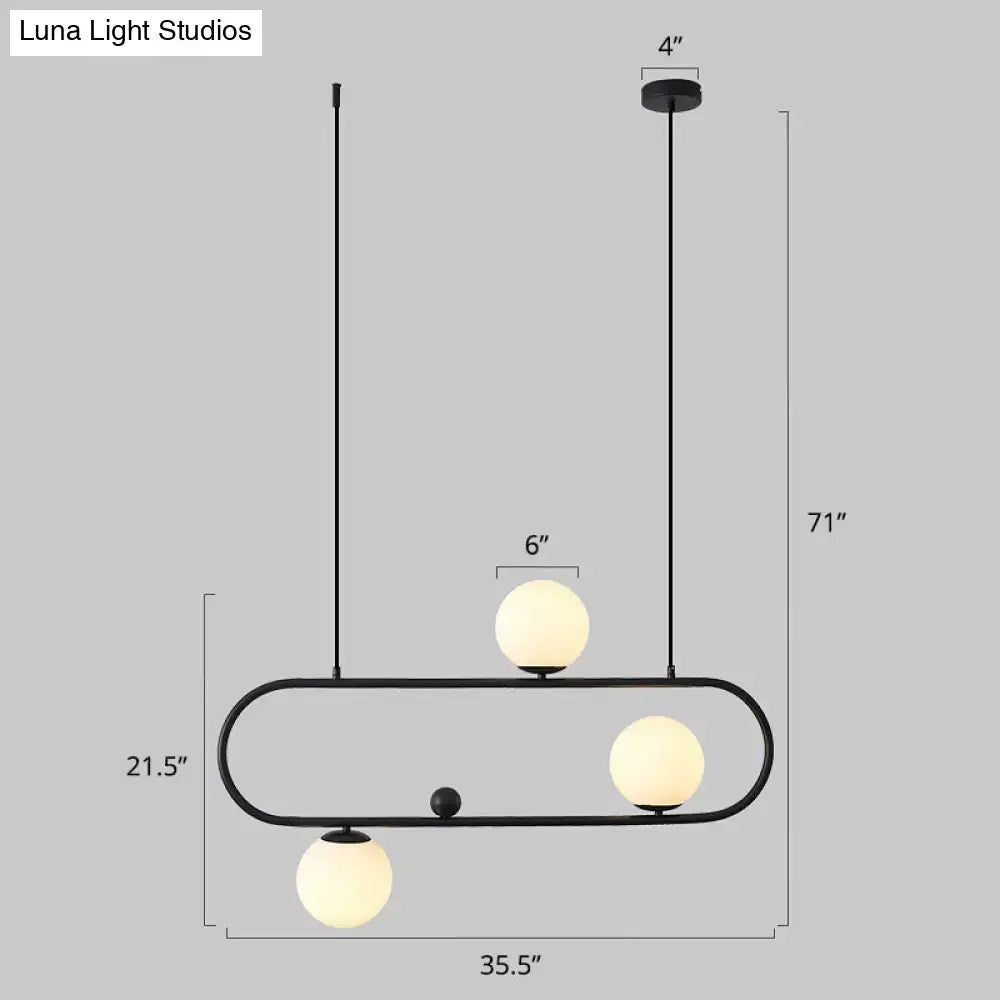 DecorBites™ minimalist metal oblong island light fixture with black frame and three frosted milk glass globe shades