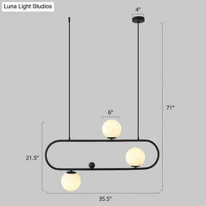 DecorBites™ minimalist metal oblong island light fixture with black frame and three frosted milk glass globe shades