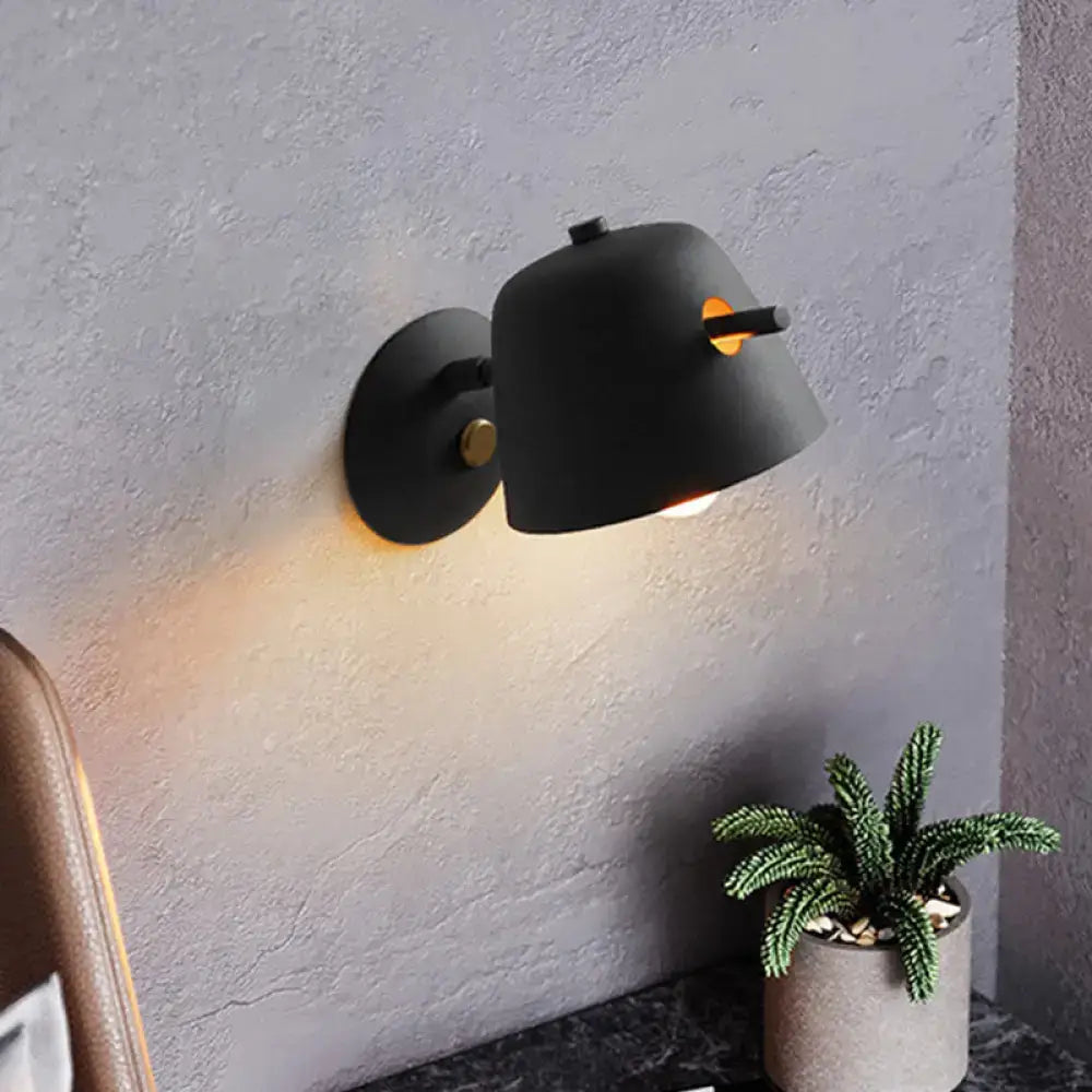 Modern black metal shade wall sconce with white blue bedroom light featuring a sleek matte finish and gold-toned hardware