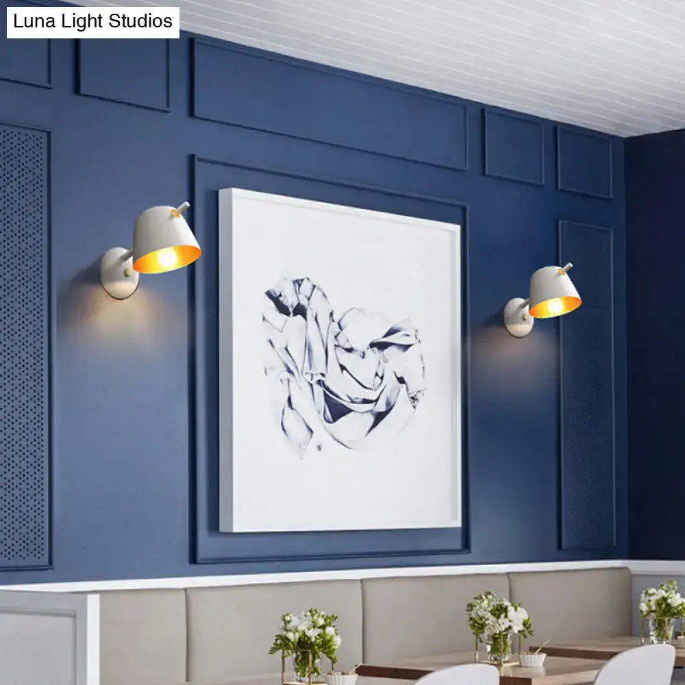Modern black metal shade wall sconces with white exterior and gold interior lighting for white blue bedroom use