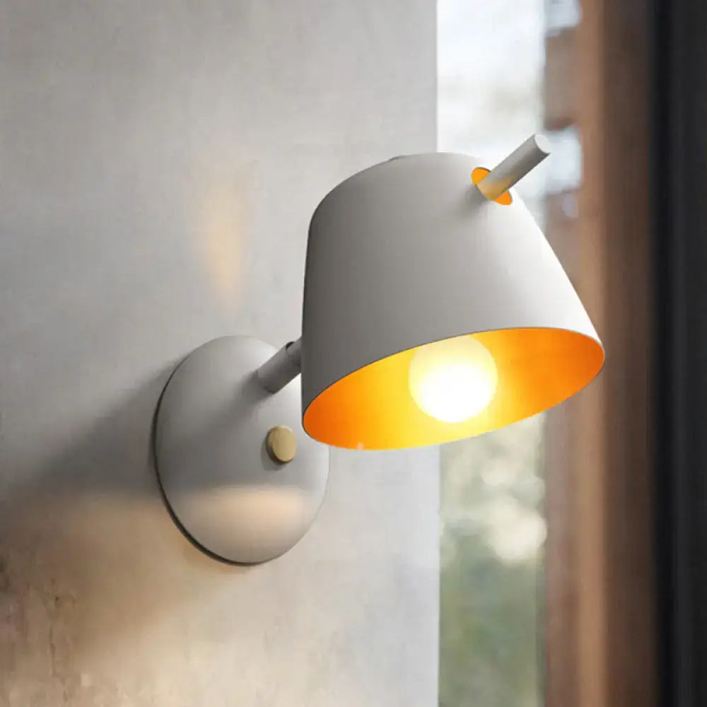 White wall-mounted lamp with metal shade, matte finish, orange interior, designed for modern white blue bedroom light