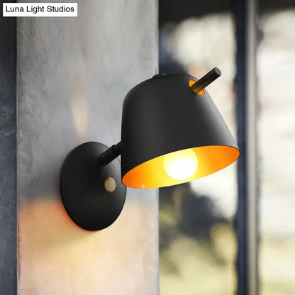 Modern black metal shade wall sconce with warm amber interior and wooden accent for white blue bedroom light