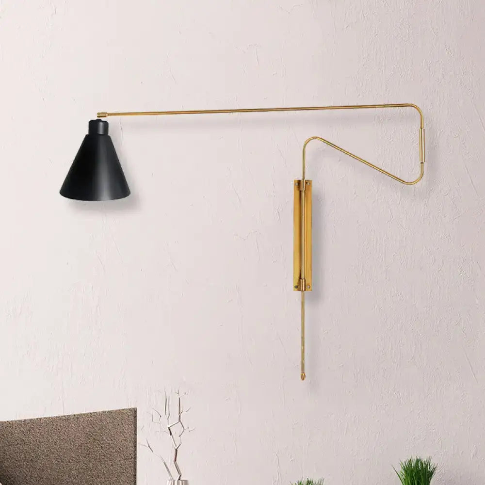 Modern black metal wall lamp with conical black shade and gold-toned articulated arm for living room use