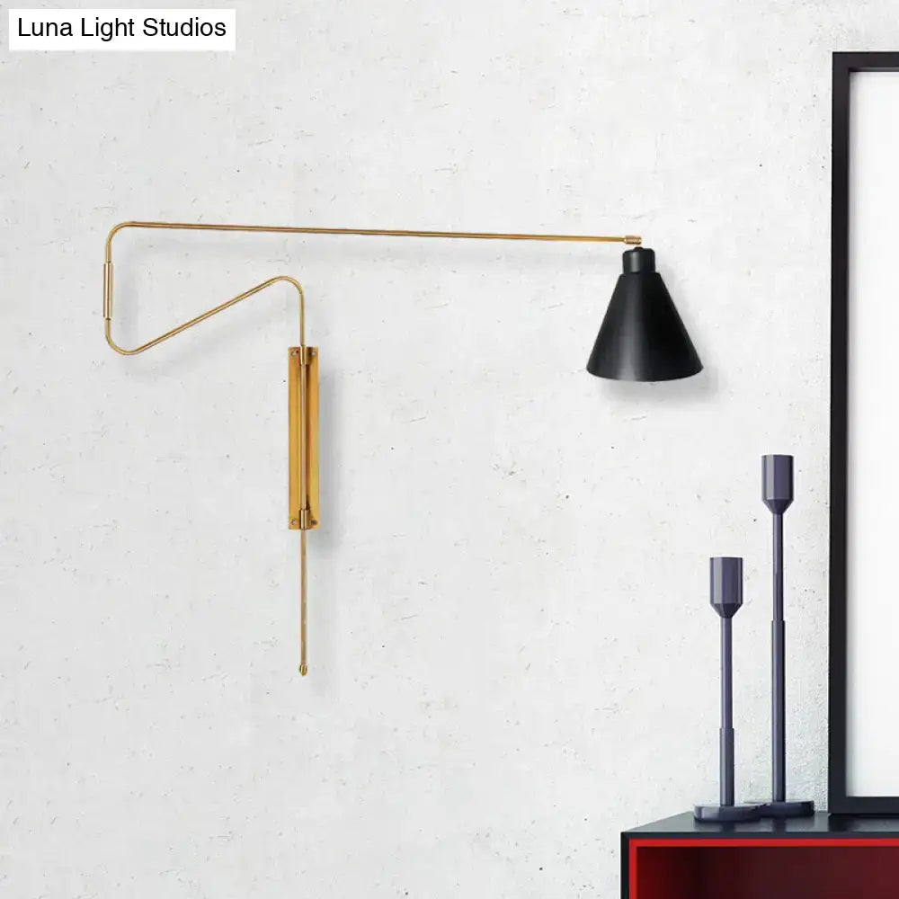 Modern black metal wall lamp with a sleek gold-toned articulated arm and matte black shade for living room lighting