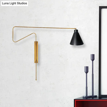 Modern black metal wall lamp with a sleek gold-toned articulated arm and matte black shade for living room lighting