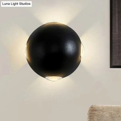 Modern black metal wall light direct wired electric spherical sconce with four warm-toned lights radiating outward