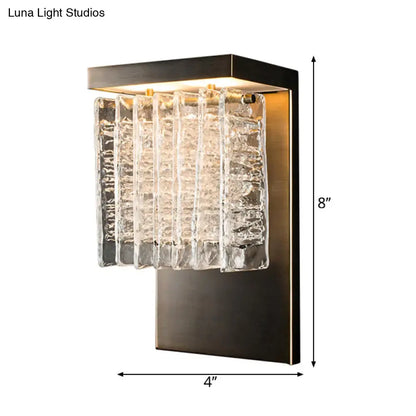 Modern black metal wall sconce with brushed bronze frame and crystal prism clear glass panels 12 inch fixture for living room