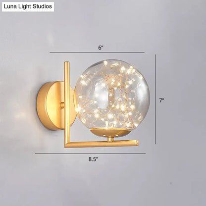 Gold-finished wall sconce mini globe fixture with clear glass globe and fairy lights ideal for modern bedroom decor fixture height included