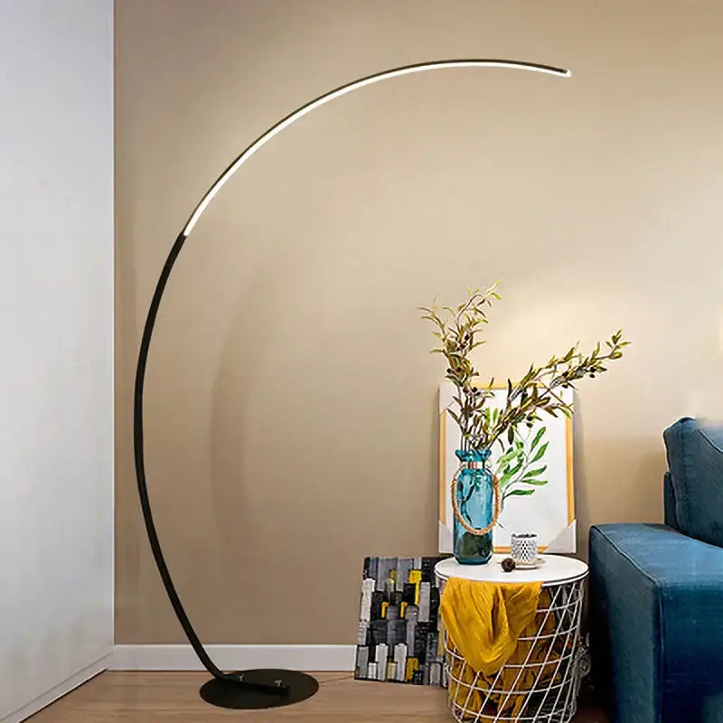 Modern black minimalist arc floor lamp with sleek curved design and dimmable integrated led lighting for living room