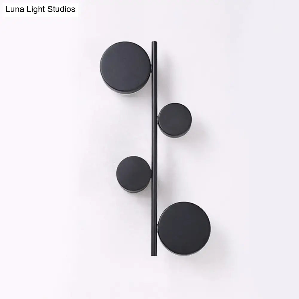 Modern black minimalist circle wall mount led sconce with four circular discs for living room lighting