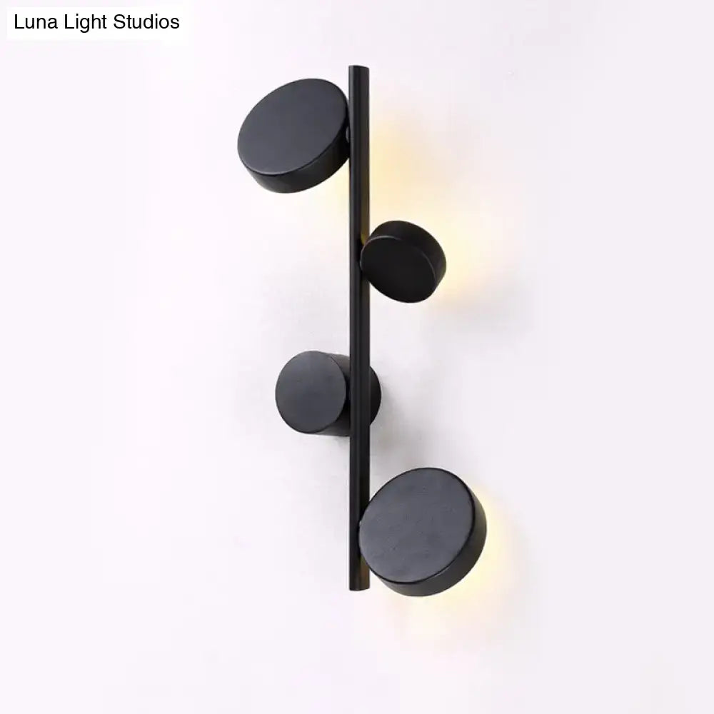 Modern black minimalist circle wall mount led sconce with four vertical circular lights for living room lighting