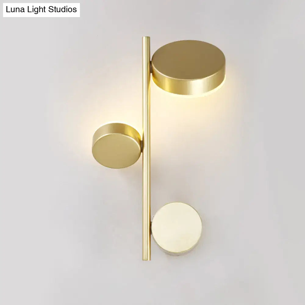 Modern gold-toned circle wall mount led sconce with three discs on a slender bar for living room decor