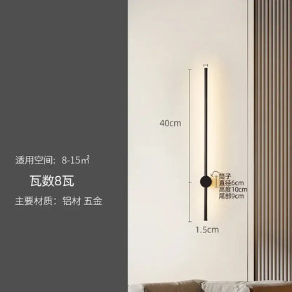 A sleek modern black wall lamp with a slim cylindrical design by decorbites led strip for staircase lighting