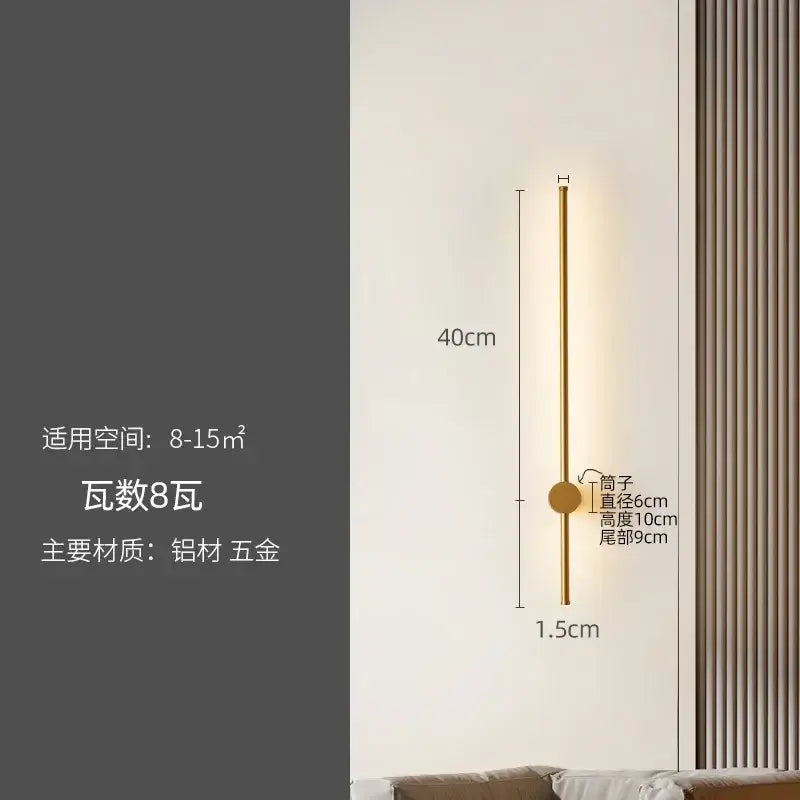 A sleek gold-toned wall lamp with a slender cylindrical body and circular base for decorbites led strip lighting