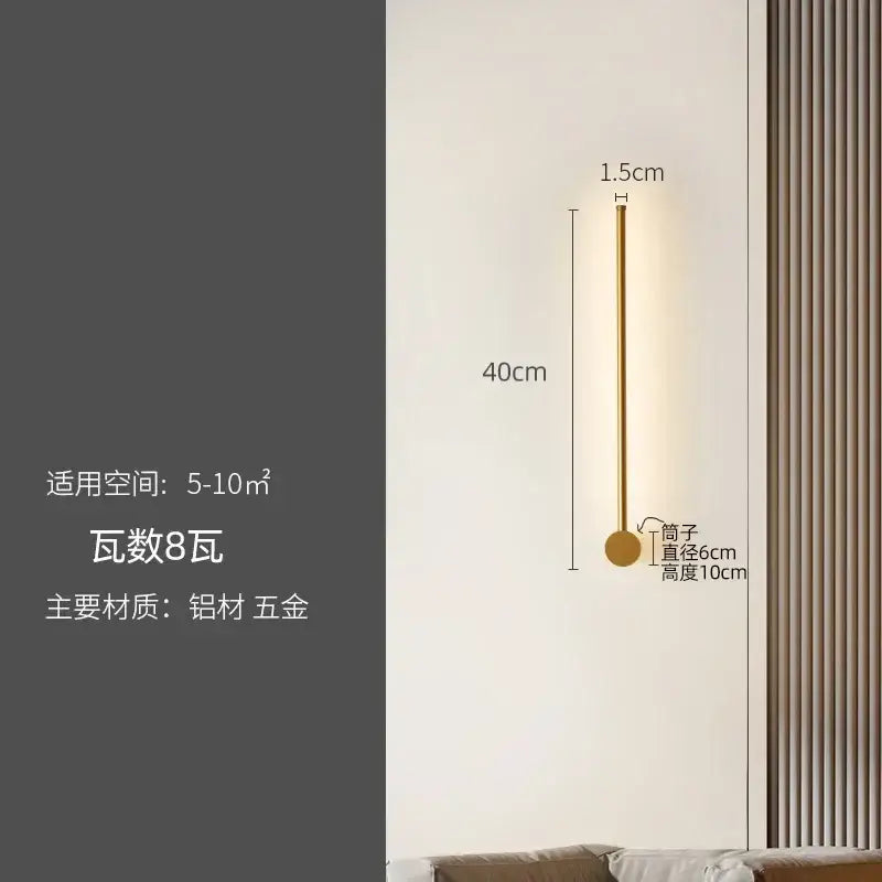 A sleek modern gold-toned wall lamp with a slender stem and round base for decorbites led strip staircase lighting