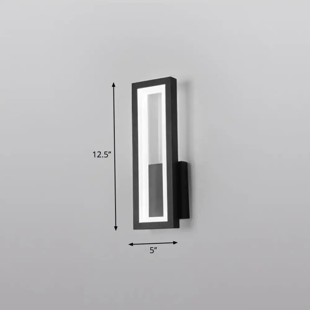 Modern black minimalist led wall sconce with a sleek rectangular design and illuminated vertical led strip for foyer lighting