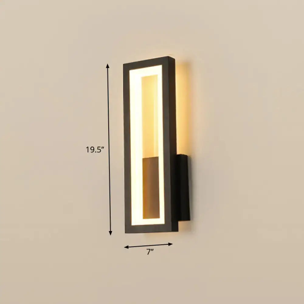 Modern black minimalist led wall sconce with rectangular design featuring warm white vertical light and amber accent for foyer