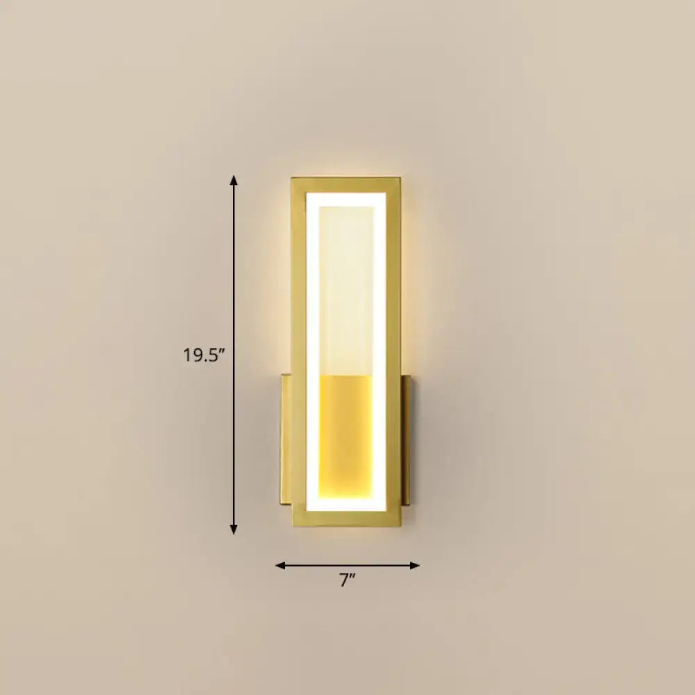 Modern black minimalist wall sconce with gold finish and vertically segmented warm yellow LED light for foyer use