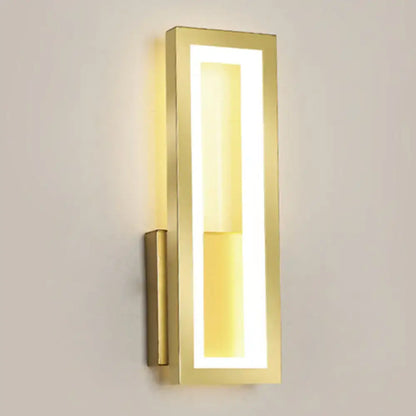 Gold-finished rectangular led wall sconce with acrylic shade and warm bedside lighting in a sleek modern design