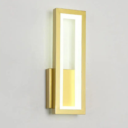 Gold-finished rectangular wall sconce with acrylic shade and warm bedside lighting in sleek modern design