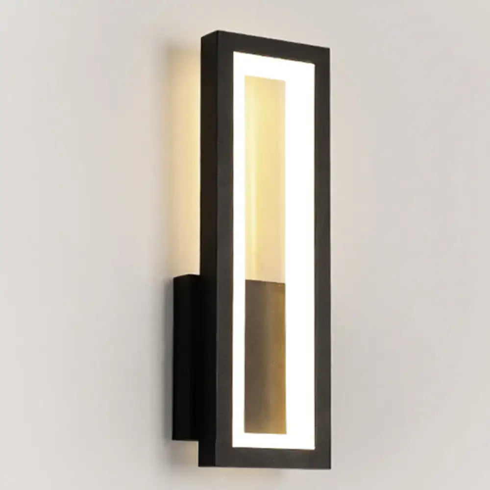 Modern black minimalist led wall sconce with acrylic shade and warm bedside lighting in sleek rectangular design