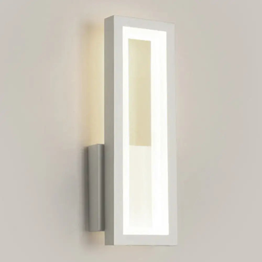Modern white rectangular led wall sconce with acrylic shade and soft bedside lighting in a sleek minimalist design