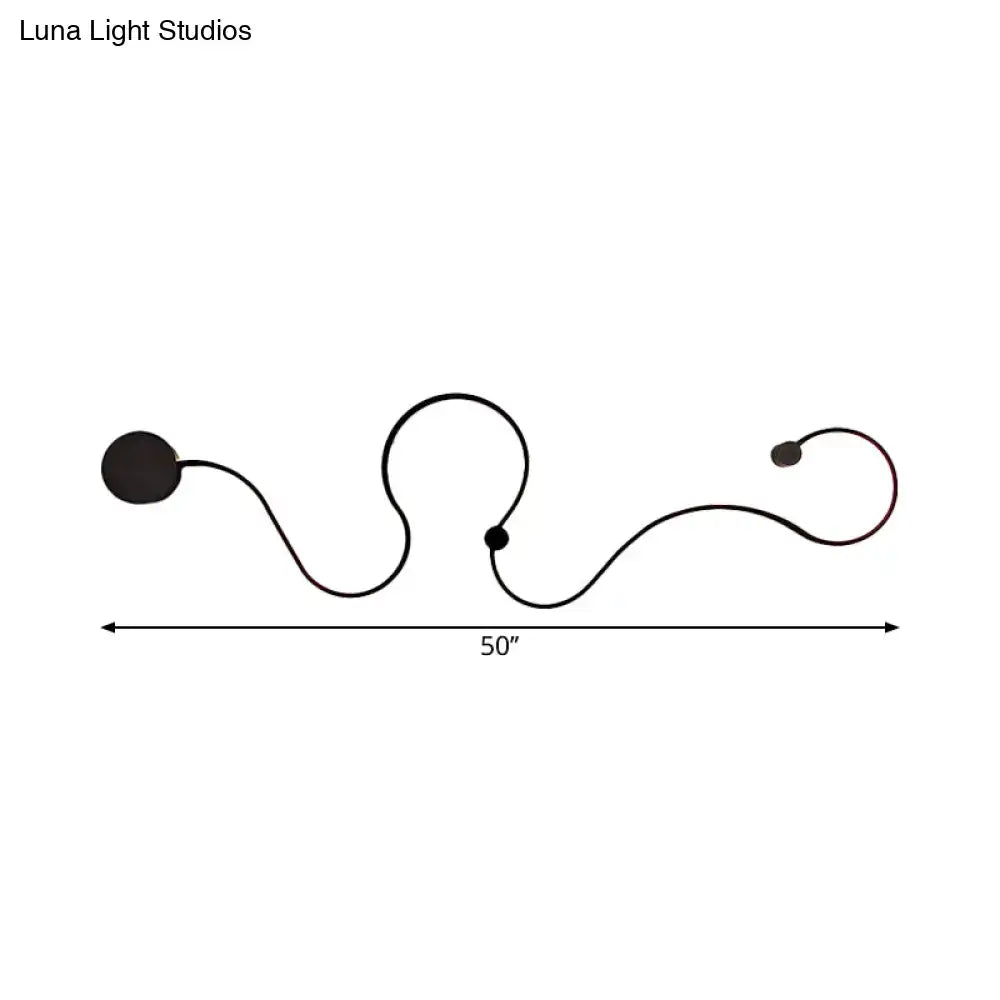 Modern black minimalist wall lamp with sleek curved wire design and two spherical shades providing white light