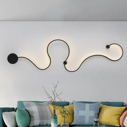 Modern black metal wall lamp with curved design and circular accents providing white light for living room use