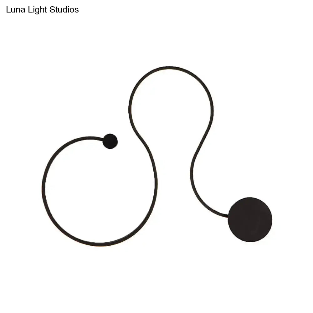 Modern black minimalist wall lamp with white light featuring a cord with two spherical ends for living room use